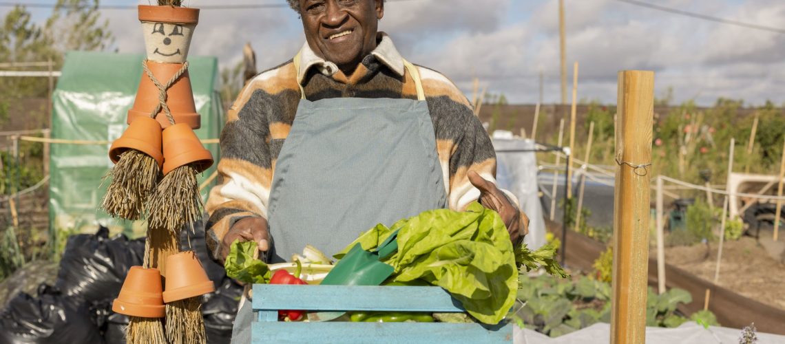 senior-man-farmer-in-the-garden-carrying-a-basket-2024-02-21-21-19-20-utc-min